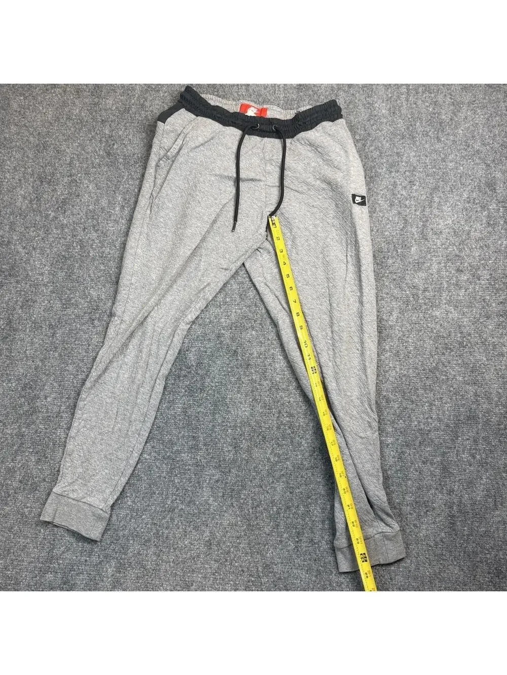 Nike gray joggers with black waistband and drawstring, size S